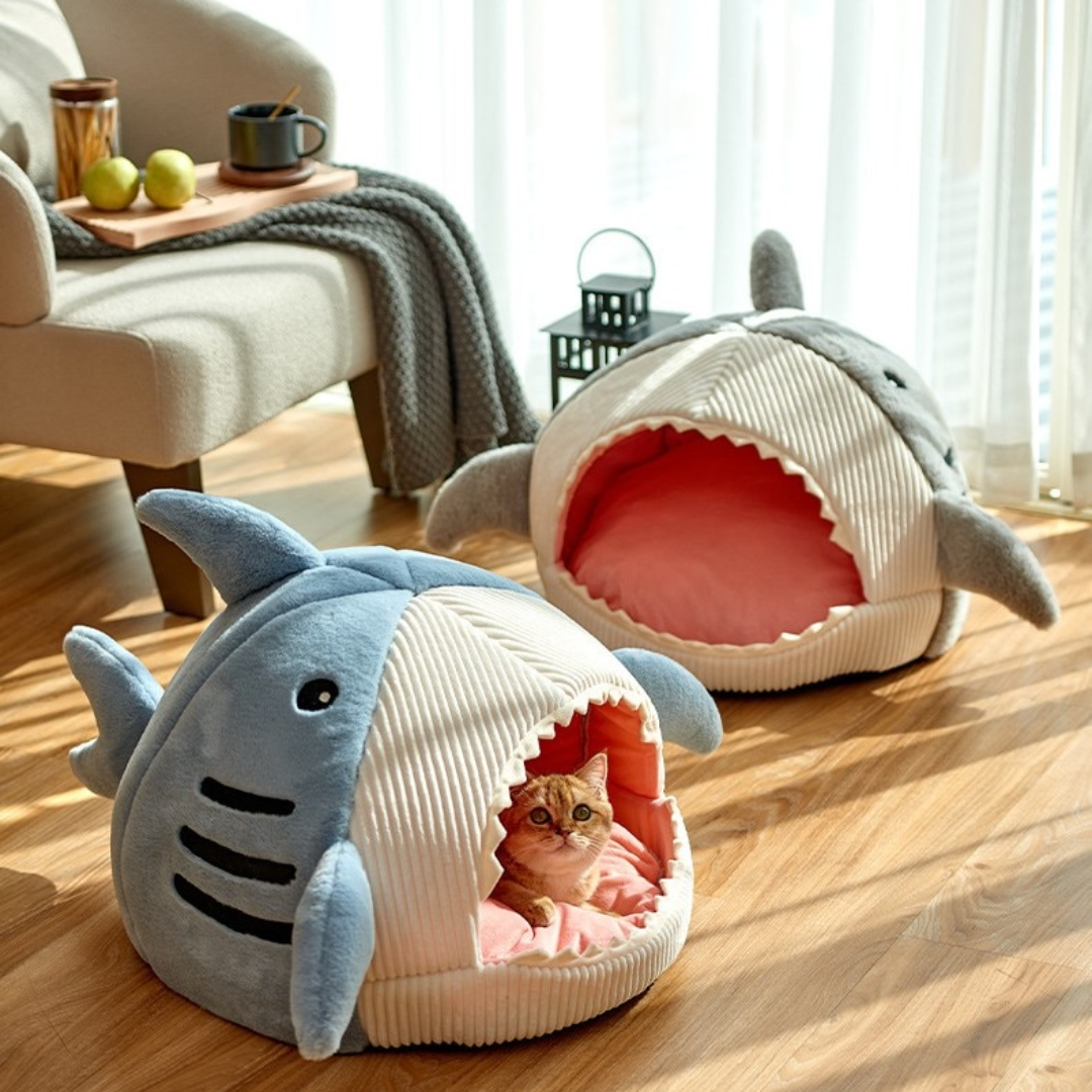 Enclosed warm shark pet bed with cat inside for comfort and relaxation.