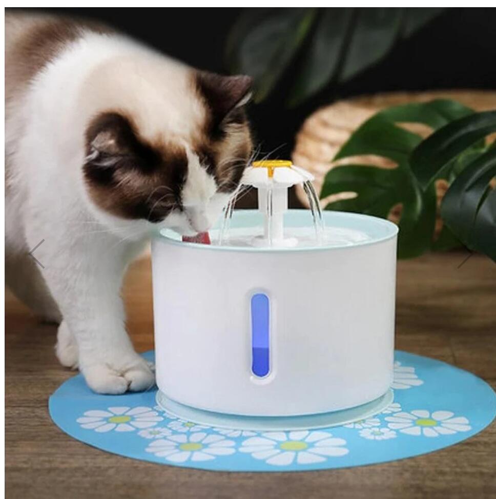 Cat drinking from a Pet Water Fountain, ensuring fresh, filtered hydration.